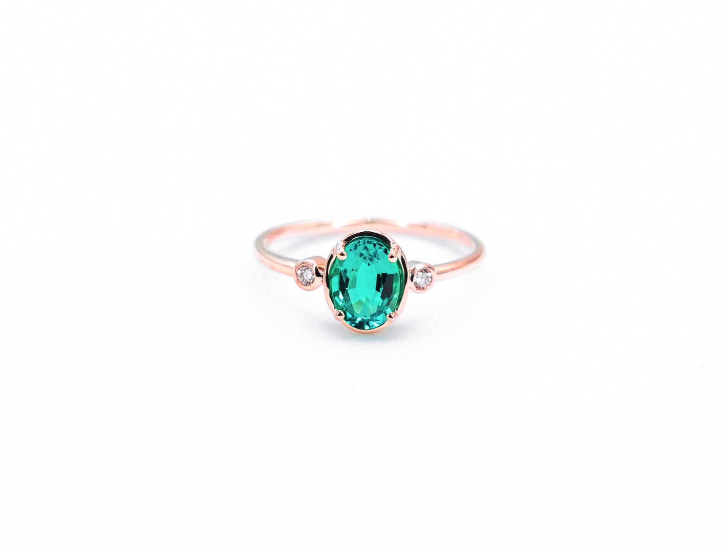 Bezel Inspired Oval Emerald and Diamond Ring