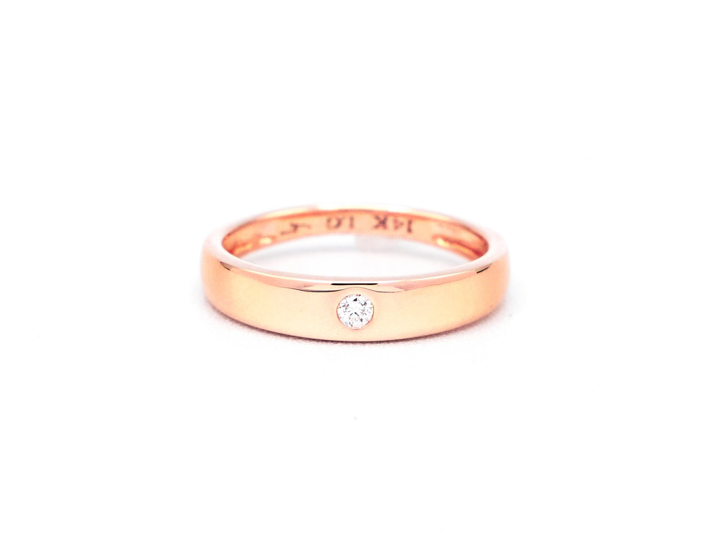 14k rose gold, lab diamond, dome ring worn on hand, front view