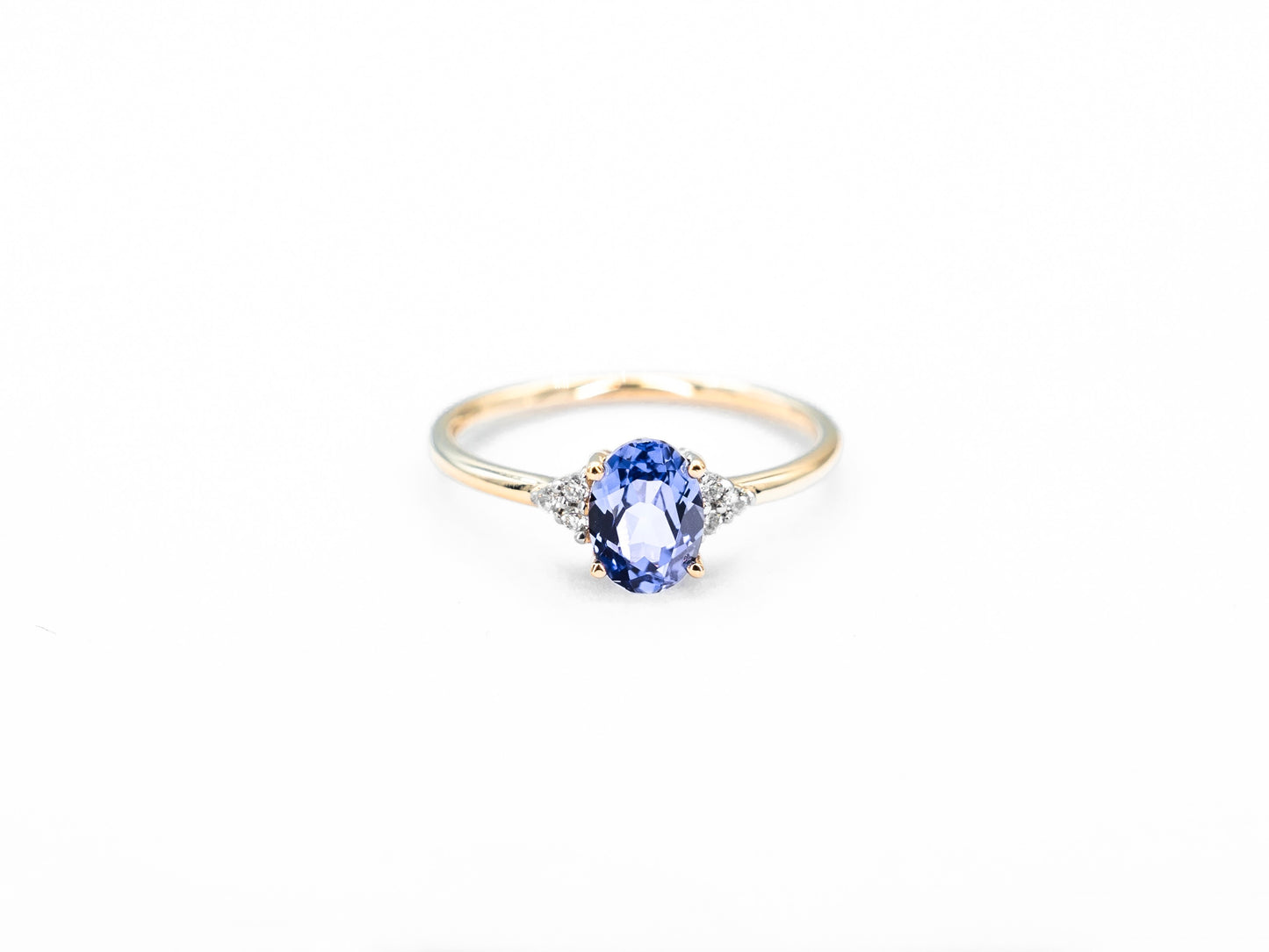 Oval sapphire yellow gold ring with diamond accents front view