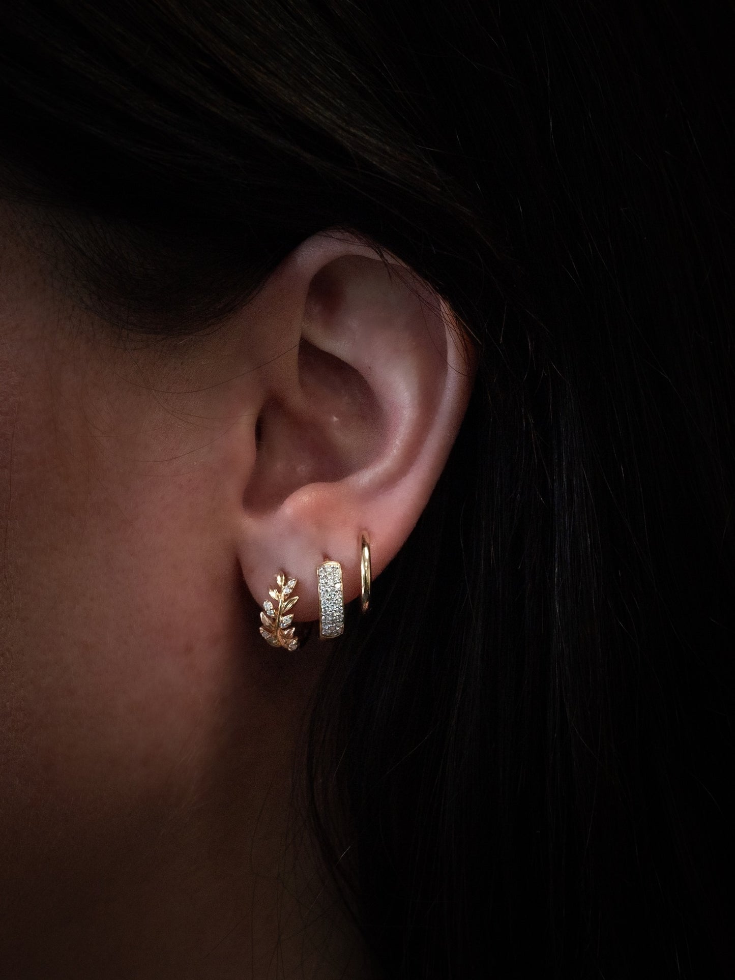 14k yellow gold, pavé lab diamond hoop earrings worn on ear, side view