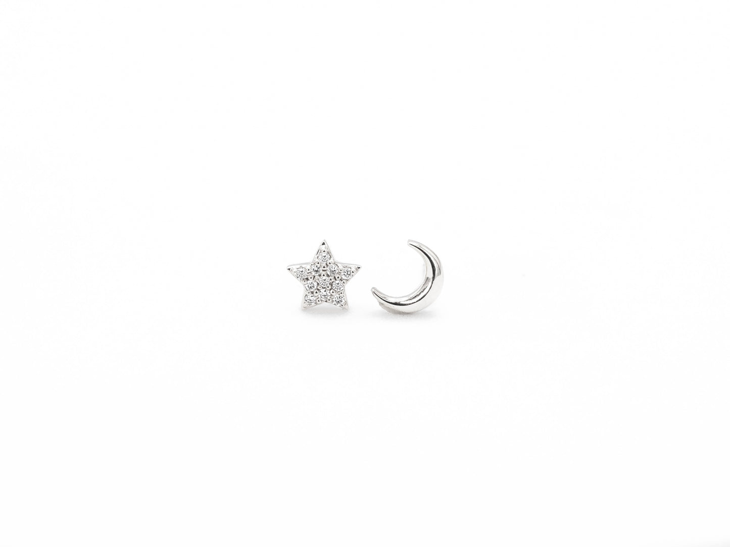 White gold moon and star diamond stud earrings, front view