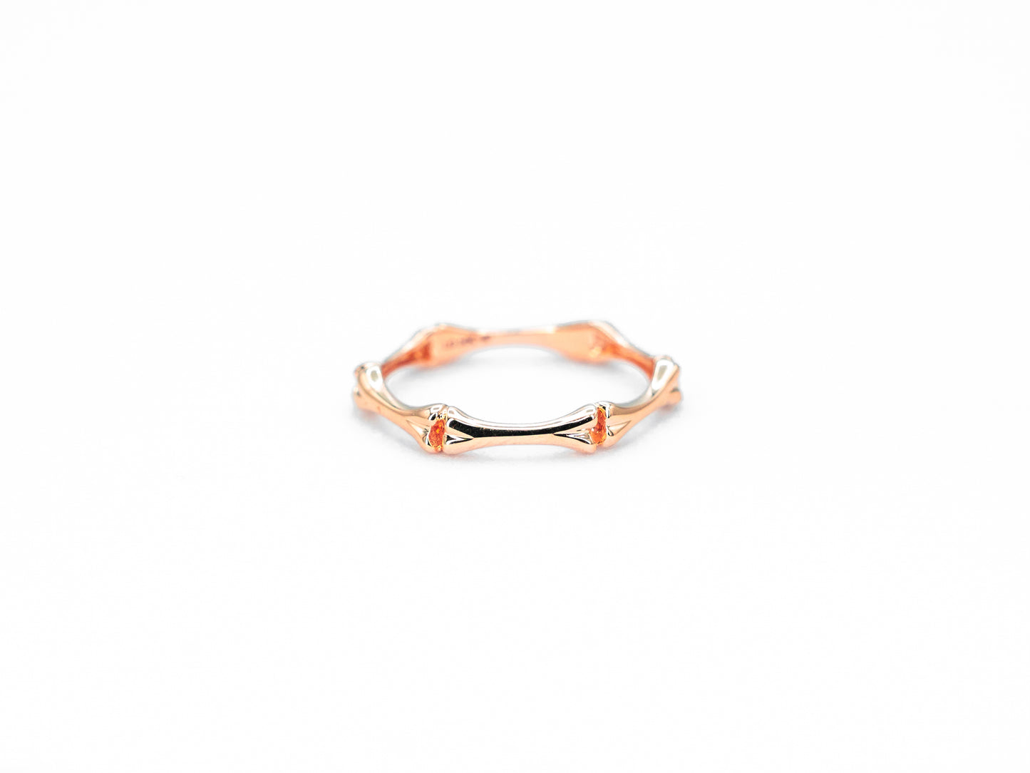 rose gold bone shaped ring, front view