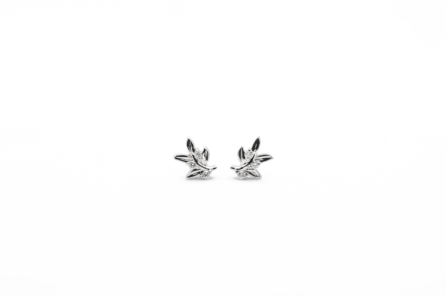 white gold leaf shaped diamond stud earrings front view