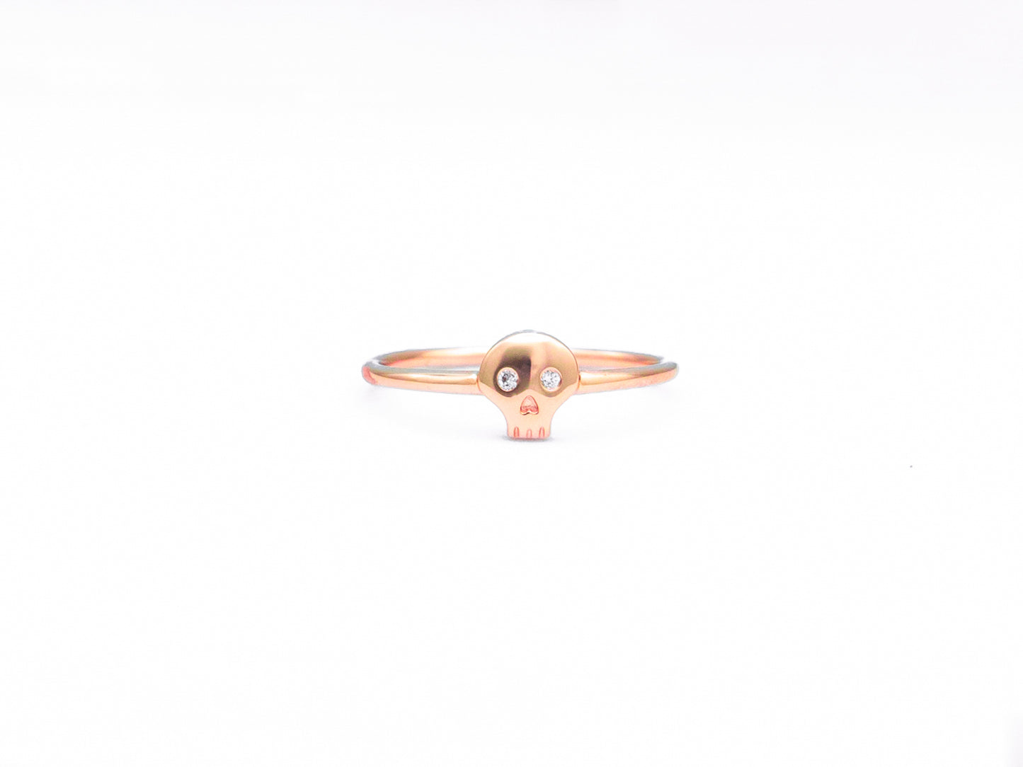 rose gold diamond skull ring, front view