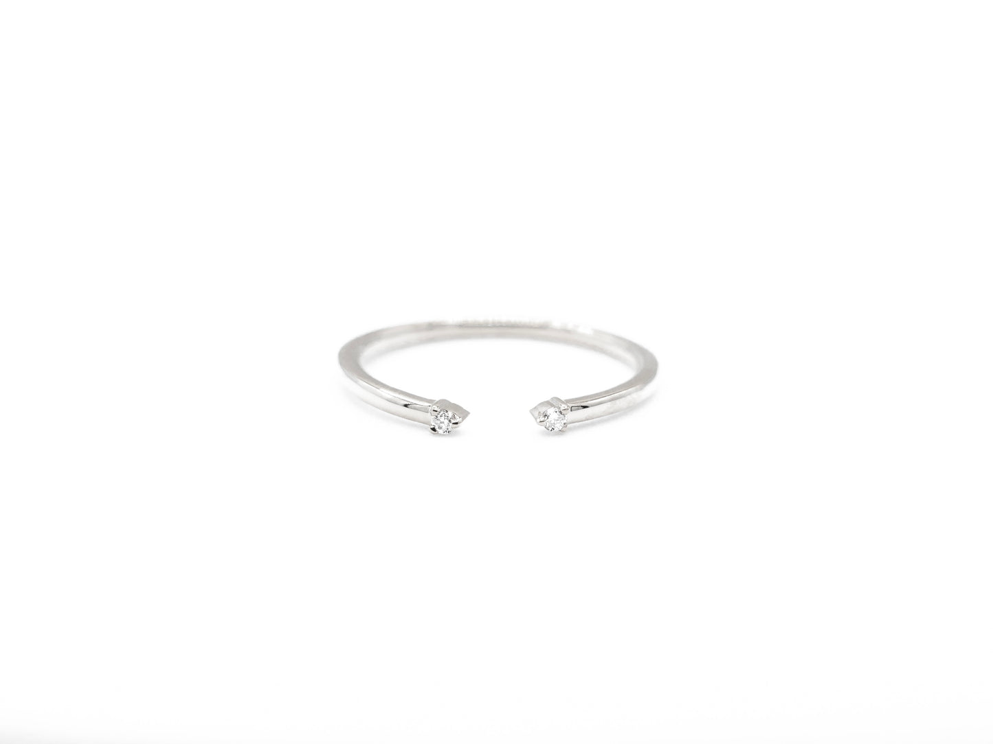 white gold cuff ring with diamond accents, front view