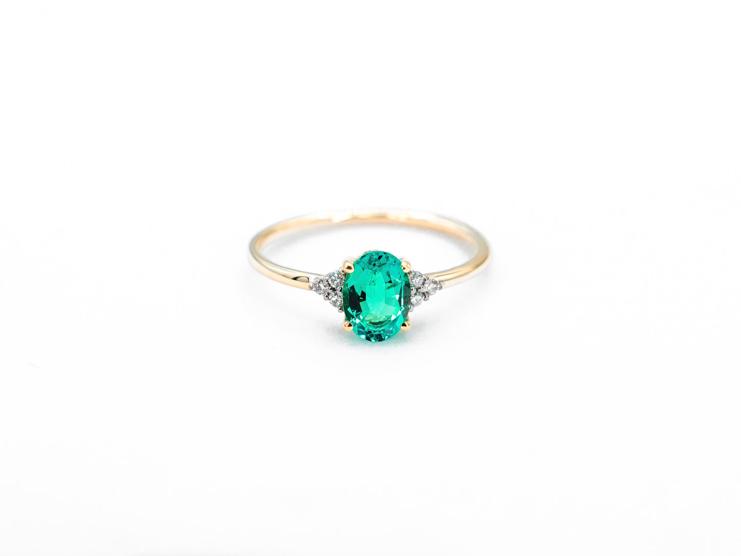 Oval sapphire yellow gold ring with diamond accents front view