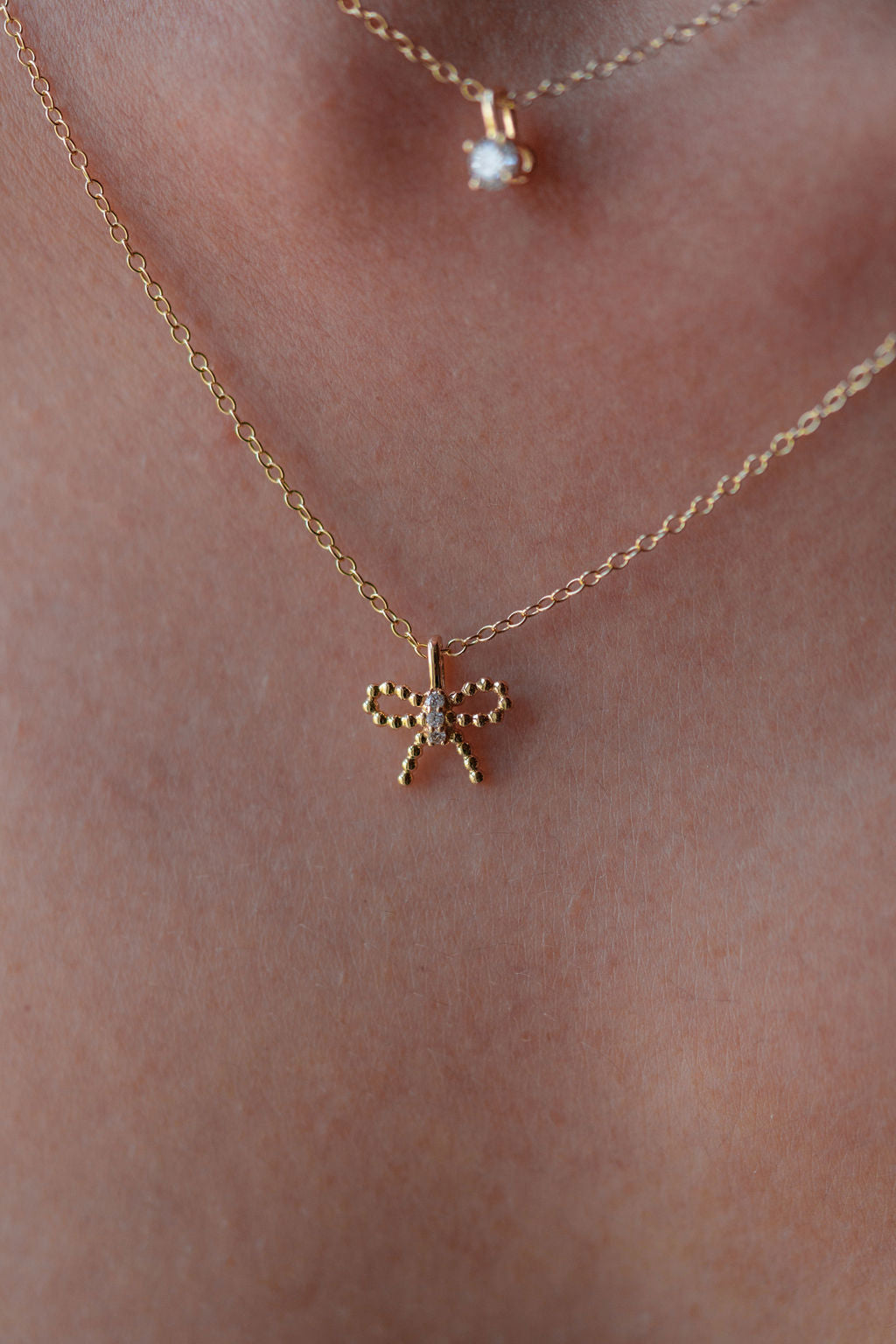 lab grown diamond, beaded bow, 14k gold pendant, front view