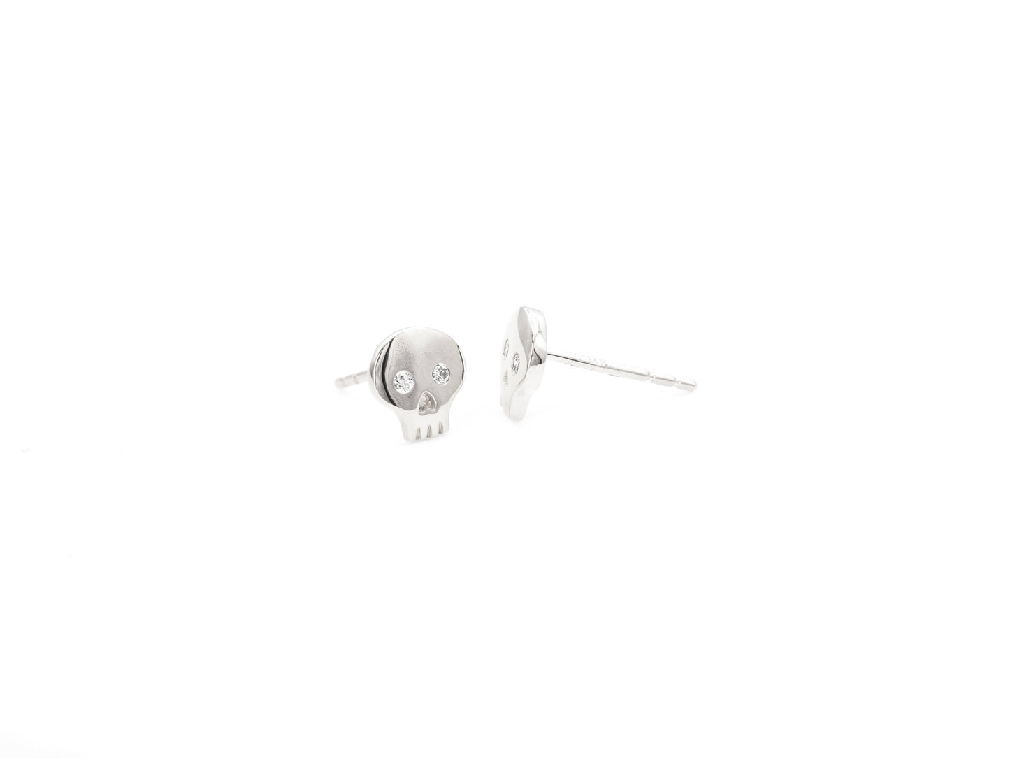White gold diamond skull stud earrings, front and side view