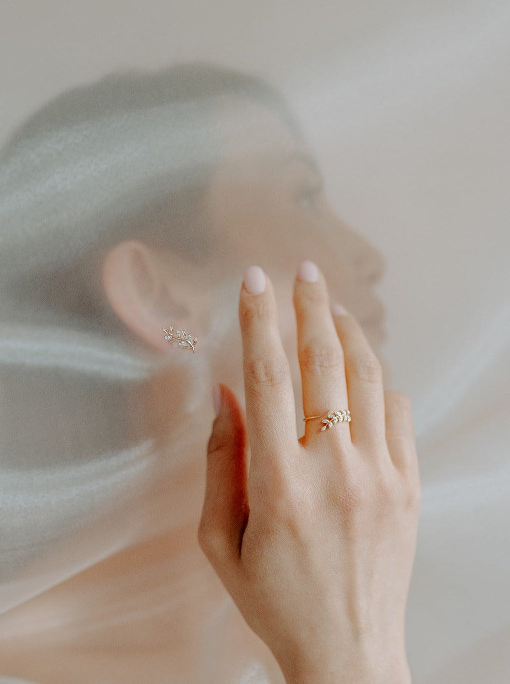 14k yellow gold, botanical leaf, lab diamond, worn on hand, wrap ring, side view