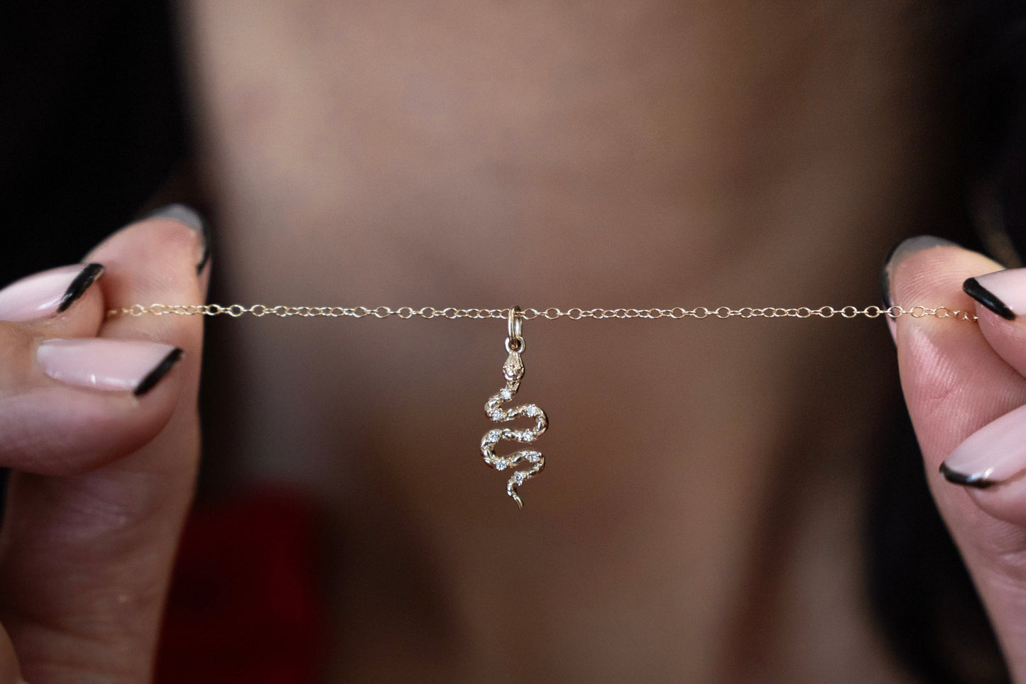 Solid yellow gold diamond snake pendant front view with chain