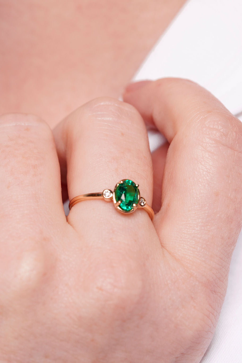 Bezel Inspired Oval Emerald and Diamond Ring