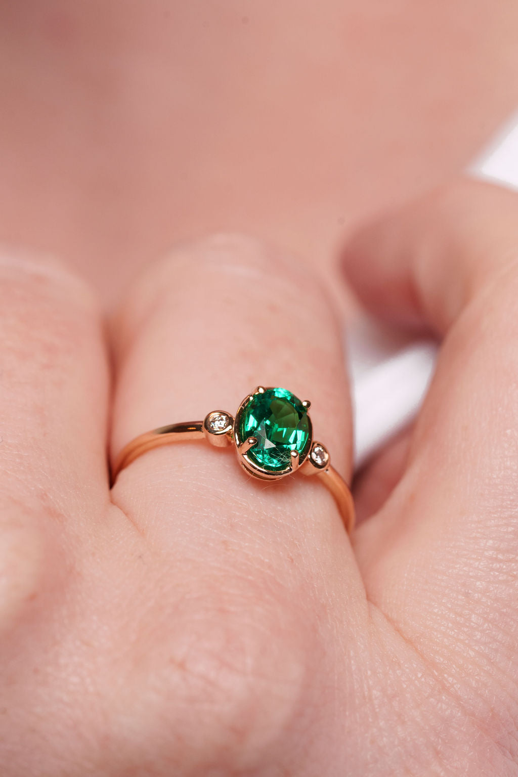 Bezel Inspired Oval Emerald and Diamond Ring