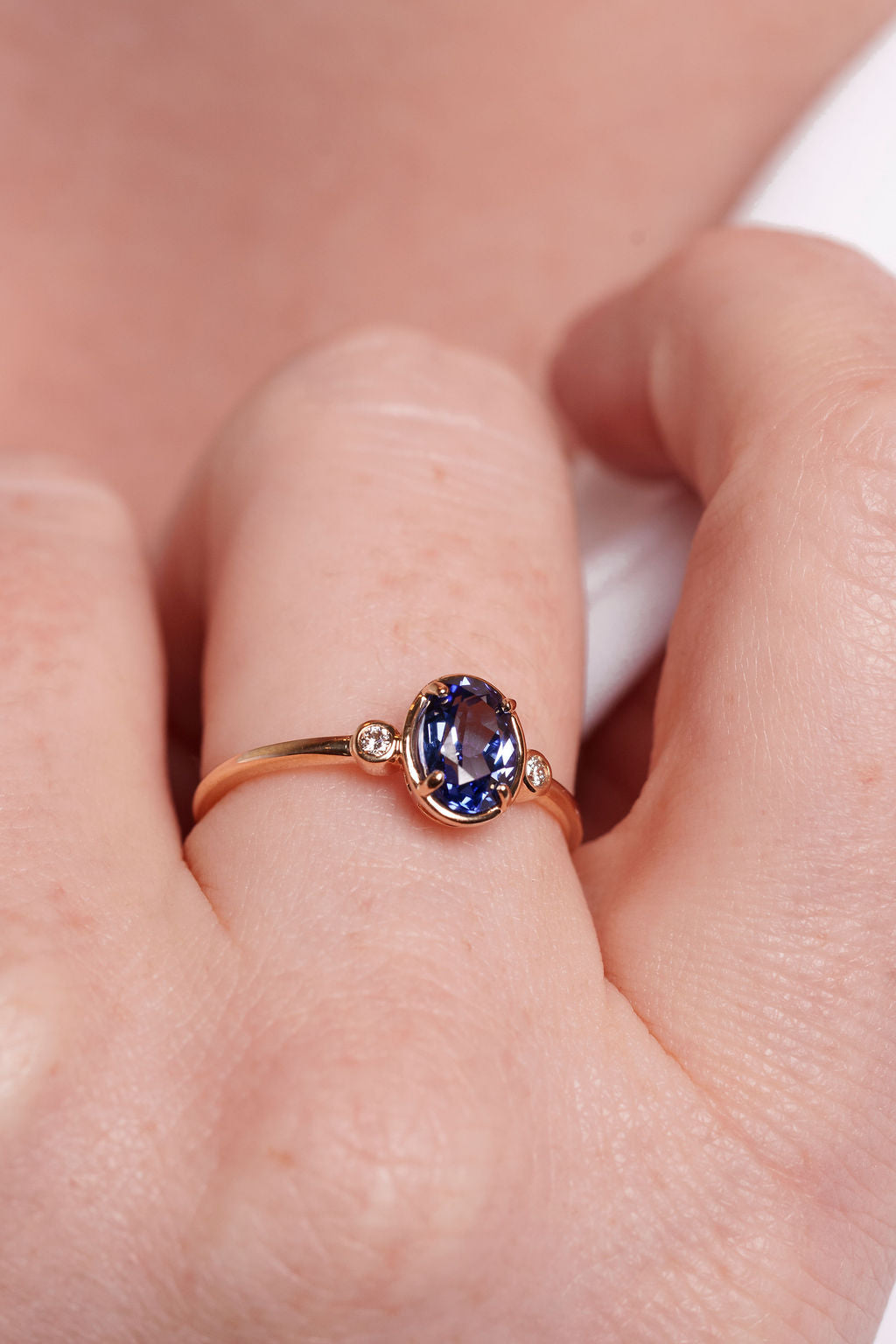 Bezel Inspired Oval Sapphire and Diamond Ring