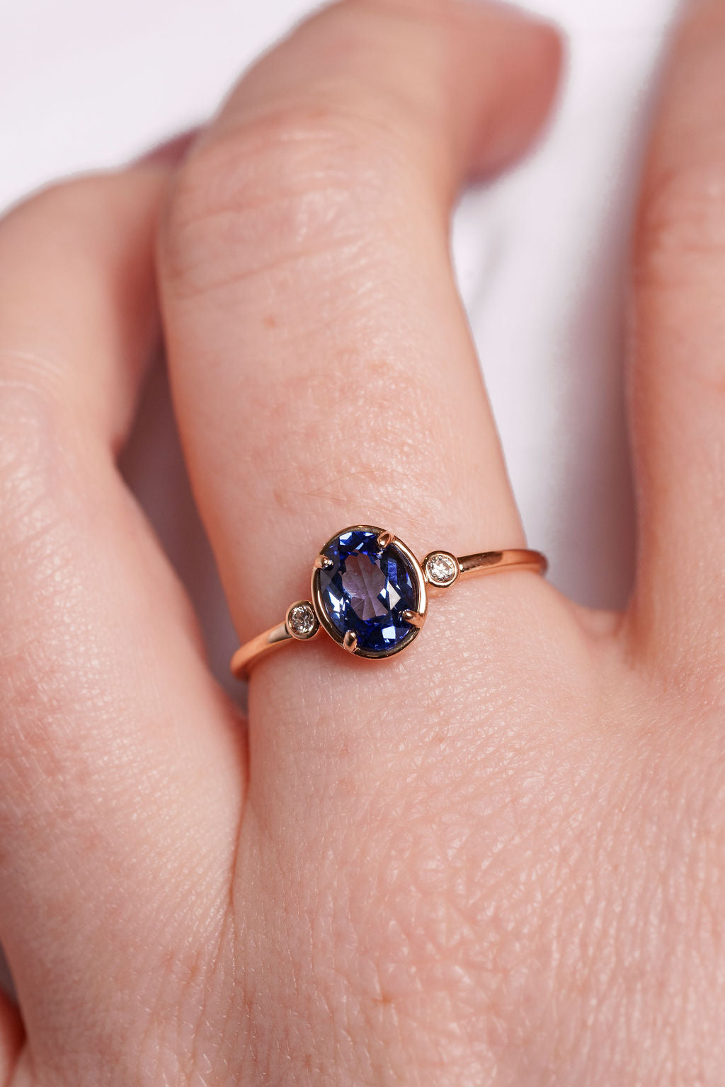 Bezel Inspired Oval Sapphire and Diamond Ring