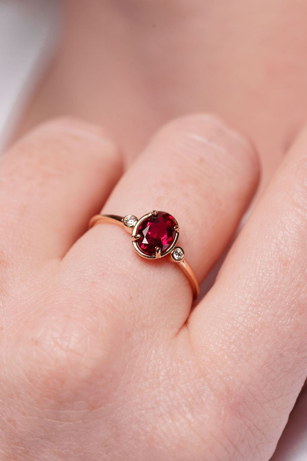 Bezel Inspired Oval Ruby and Diamond Ring